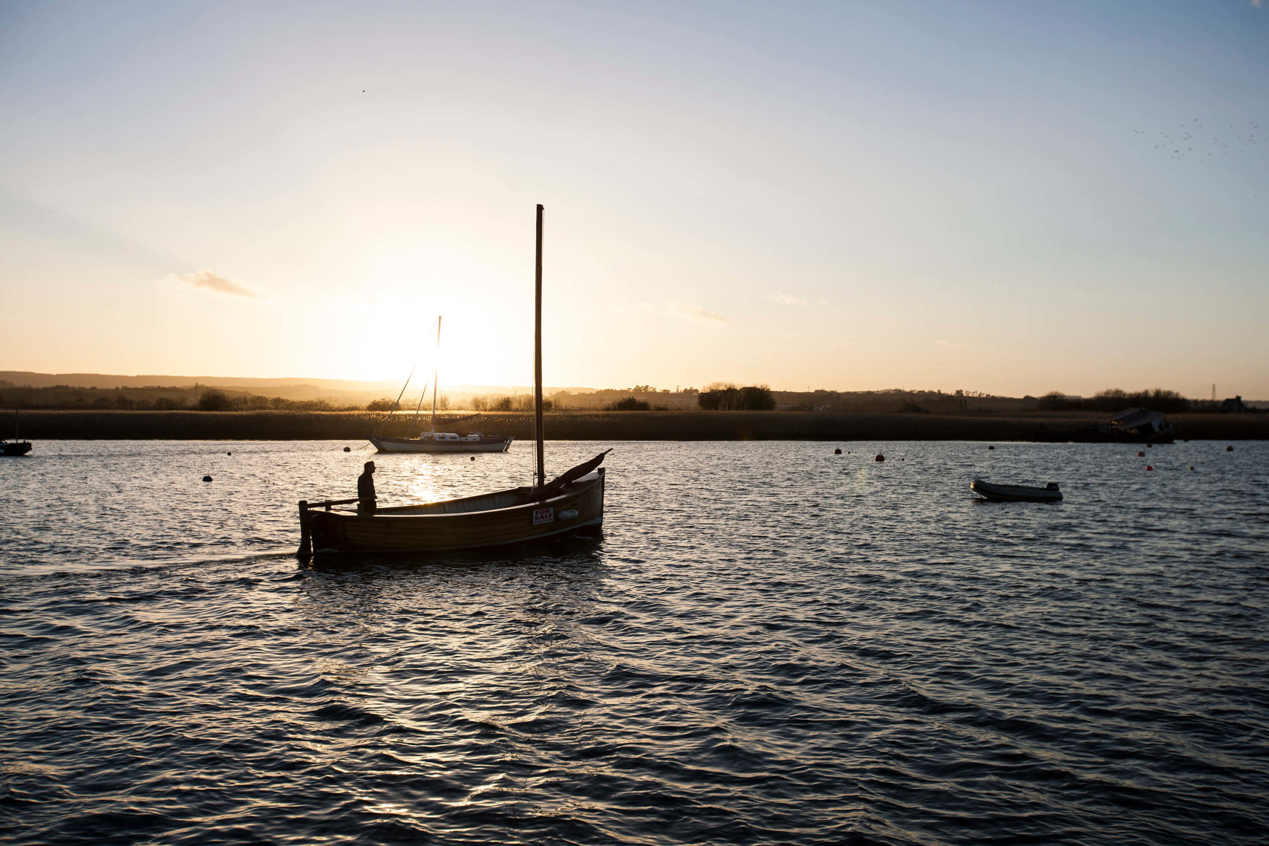 Fisherman returns home on the River Exe, Exeter