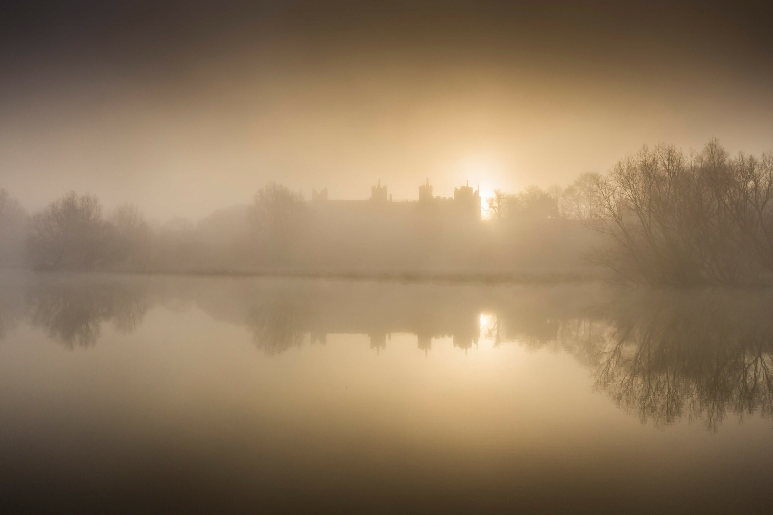 Framlingham Castle emerges from the morning mists